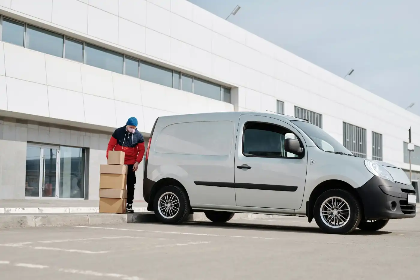 Employee delivering NFC tracked parcels